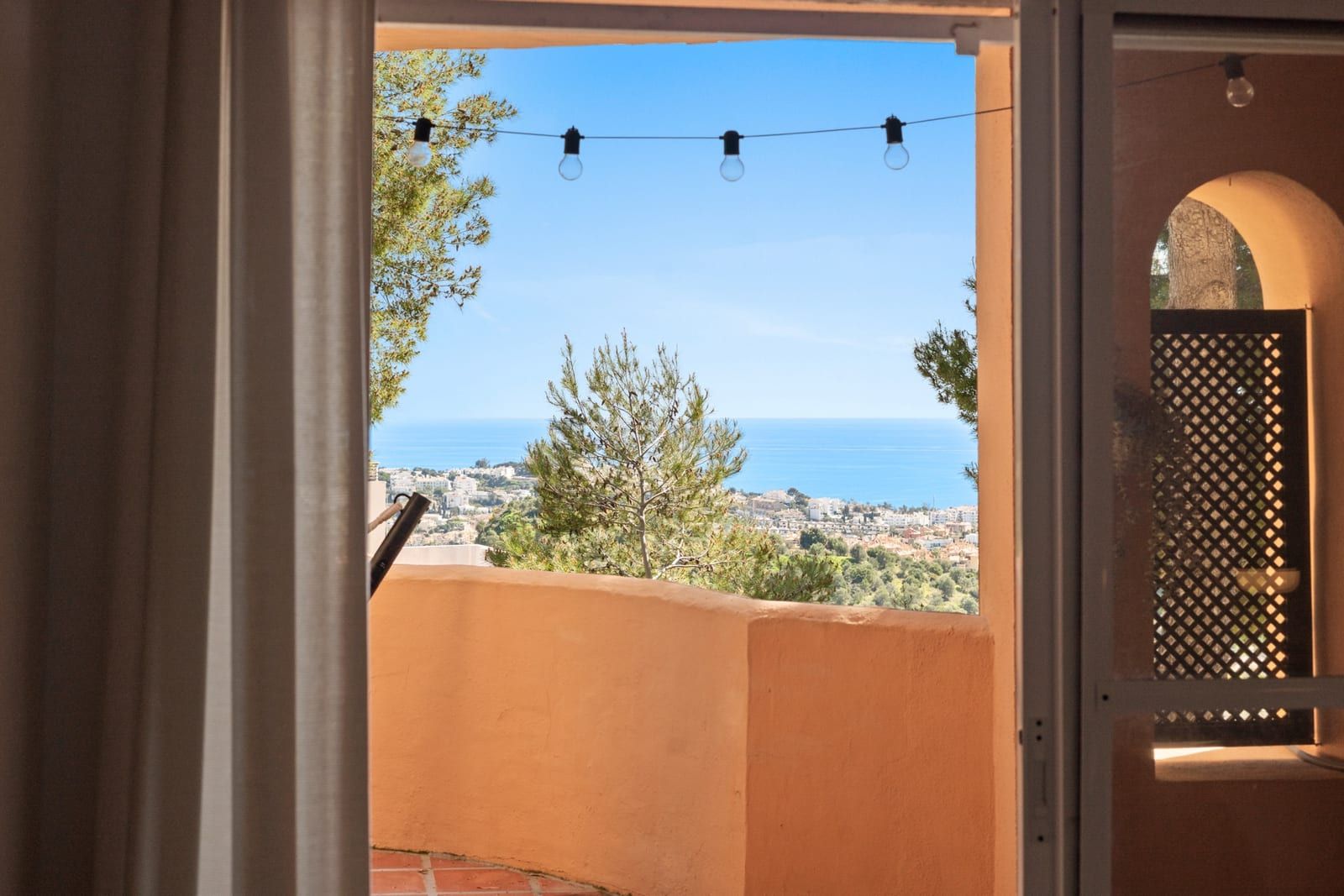 Sea view through the bedroom window at La Quinta Ca5a